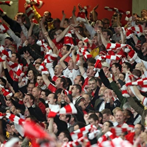 Arsenal fans celebrate the 3rd goal