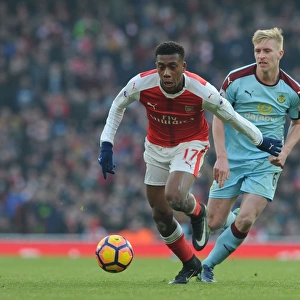 Arsenal's Alex Iwobi Faces Off Against Burnley's Ben Mee in Premier League Clash