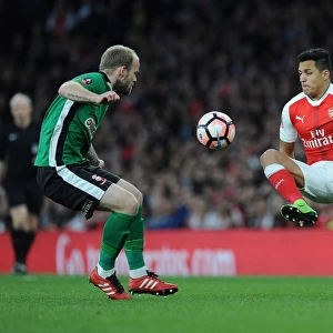 Arsenal's Alexis Sanchez Clashes with Lincoln City's Bradley Wood in FA Cup Quarter-Final