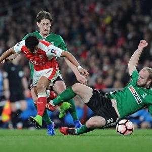 Arsenal's Alexis Sanchez Outmaneuvers Lincoln City Defenders during The Emirates FA Cup Quarter-Final