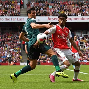 Arsenal's Reiss Nelson Clashes with Burnley's Jack Cork in Premier League Showdown