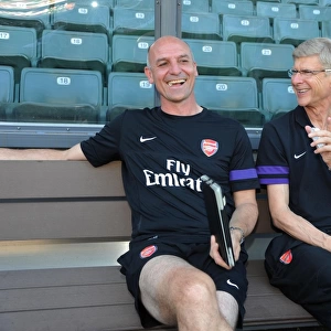 Arsene Wenger and Steve Bould: A Light-Hearted Moment Before Arsenal's Pre-Season Friendly against Kitchee (2012)