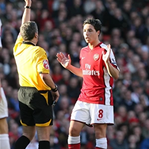 Samir Nasri (Arsenal) booked by referee Alan Wiley