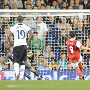 Samir Nasri shoots past Tottenham goalkeeper Stiope Pletikosa to score the 3rd Arsenal goal