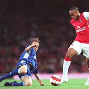 Thierry Henry and Luka Modric Clash: Arsenal's Narrow 2-1 Victory over Dinamo Zagreb in the UEFA Champions League