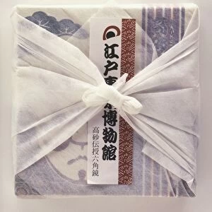 Box of Japanese cookies gift-wrapped in paper and in cloth
