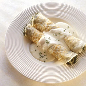 Chicken crepes florentine on plate