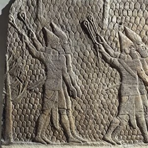 Scene with Assyrian soldiers armed with slings, Relief from Royal Palaces of Nineveh, circa 645 B. C