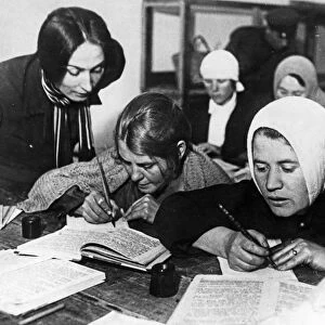 Soviet women being taught to read and write during a literacy drive in the early 1930s, ussr