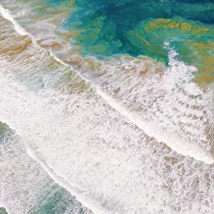 Abstract drone view of waves breaking
