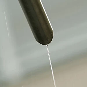 Rain water flowing from a drain pipe