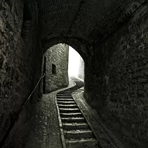 Winding Stone Staircase in Tunnel