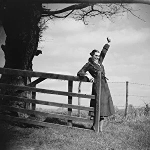 Muriel Haken waves from a gate. 1939