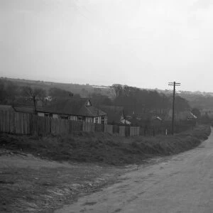 The road through North Lancing, West Sussex showing the Sussex downs ( hills ) 1931