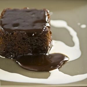 Sticky toffee pudding with cream swirl credit: Marie-Louise Avery / thePictureKitchen