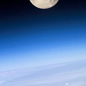 Full Moon; view above Earths horizon and airglow