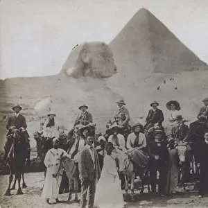 Group of tourists at the Pyramids at Giza, Egypt (b / w photo)