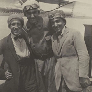 Portrait three men smiling front airplane Fedele Azari