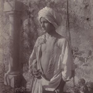 Young Man White Robe Head Gear Holding Scabbard