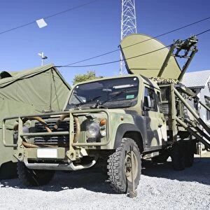 An Australian Defense Force Satellite Terminal Assembly is mounted on a 6x6 vehicle