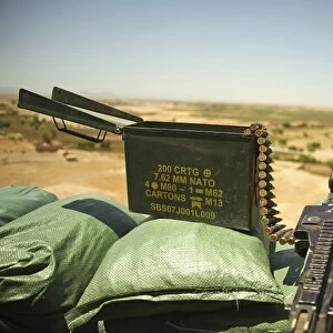 A M240B medium machine gun is positioned at an observation post