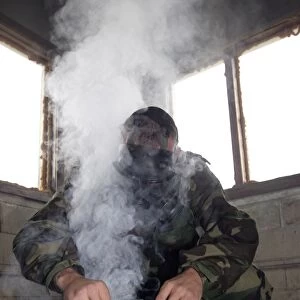 A marine fills the gas chamber with more CS gas