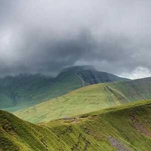 Fan y Big, Cribyn and Pen y Fan viewed from the south east, with storm clouds approaching. These are three glacial cwm's, corries / cirques carved into the Devonian, Old Red Sandstone escarpment, Brecon Beacons National Park, Wales, UK