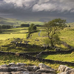 Malham Moor, with stormy skies over Winskill and Ribblesdale with Pen-y-Ghent shrouded in cloud