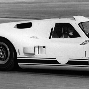 British racing driver and engineer Ken Miles driving a 1966 Ford GT40 J racing car