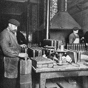 Filling shrapnel shells in a British munitions factory, World War I, 1914-1918