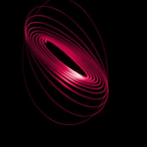 Red Light Curving In A Sphere Shape On A Black Background