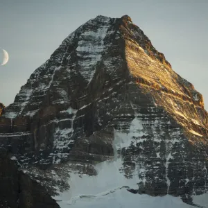 Crescent moon and summit of Mount Assiniboine, Mount Assiniboine Provincial Park, British Columbia Crescent moon and summit of Mount Assiniboine, Mount Assiniboine Provincial Park, British Columbia