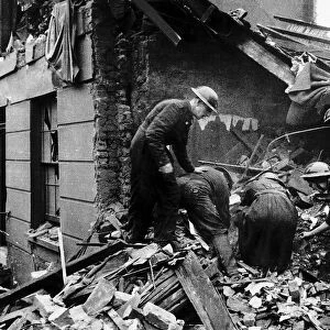 ARP and police searching a house in North West London that was wrecked by a German bomb