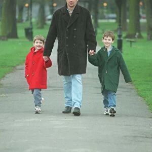 Dominic Taylor actor with his sons Arthur 6 in red coat