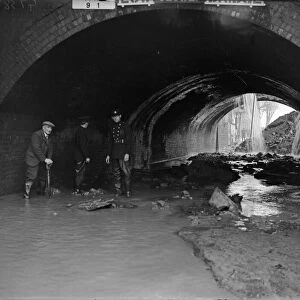 Firemen and rescue worker survey the scene after a direct hit on the Birmingham to