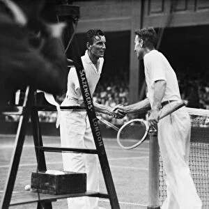 Fred Perry (GB) shakes hands with his opponent George Lott