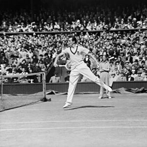 Fred Perry (pictured) (GB) competing at The Wimbledon Tennis Championships against