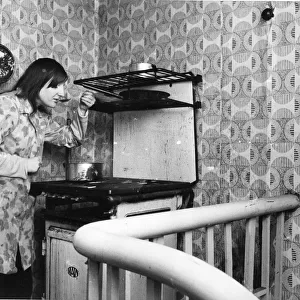 The Interior of slum housing in an area of Newcastle - Jaqcueline tastes her cooking