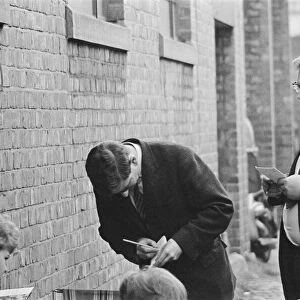 Journalists take notes as Beatles fans queue for tickets in Newcastle Upon Tyne