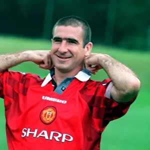 Manchester Utd new home strip launch with Eric Cantona feeling his collar