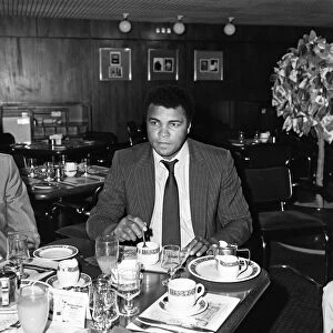 Muhammad Ali enjoying a meal before his journey back to Chicago USA after his stay here