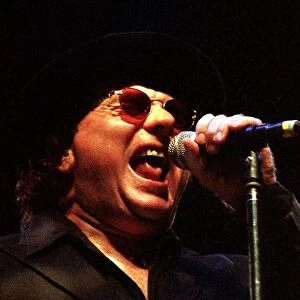 Rock singer Van Morrison hat glasses on stage June 1998