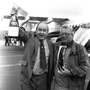 A smiling Sir Harry Secombe flew into Newcastle Airport
