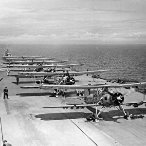 Squadron of Fairey Swordfish planes prepare to launch from the flight deck of the Royal