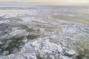 Netherlands Prints: Aerial view of frozen Markermeer with drifting ice after a long period of frost in