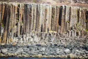 Basalt column formations and rocks at coastal area, Isle of Ulva, Scotland Basalt column formations and rocks at coastal area, Isle of Ulva, Scotland