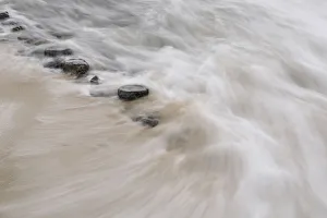 Breakwater flooded by water as it becomes high tide, The Netherlands, Noord-Holland