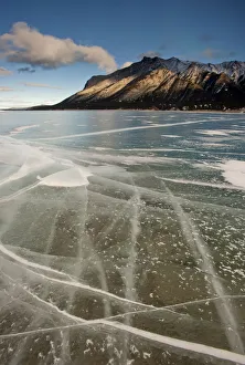 Cracked surface of frozen lake, Abraham Lake, Canadian Rockies, Alberta, Canada Cracked surface of frozen lake, Abraham Lake, Canadian Rockies, Alberta, Canada