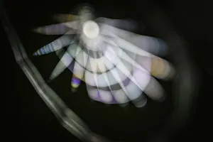 Highly experimental photo of a spiderweb outside in the dark, shot deliberately out of focus using a flashlight as Highly experimental photo of a spiderweb outside in the dark, shot deliberately out of focus using a flashlight as