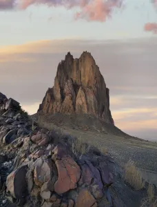 Rock Formation Prints: Rock formation at sunset, remenant basalt core of extict volcano, Ship Rock, New Mexico